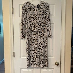 New York & Company XL V necked black and cream dress with silver buckle.